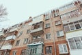 Russia. Terrible huge icicles formed on the balcony of a multi-storey building due to a poor roof storm system Royalty Free Stock Photo