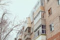 Russia. Terrible huge icicles formed on the balcony of a multi-storey building due to a poor roof storm system Royalty Free Stock Photo