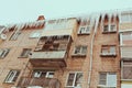 Russia. Terrible huge icicles formed on the balcony of a multi-storey building due to a poor roof storm system Royalty Free Stock Photo