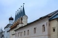 Russia, Tikhvin, December 2020. Fragment of the monastery wall with a belfry. Royalty Free Stock Photo