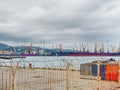 Russia, Tuapse 15.11.2020. Industrial seaport with large ferries and many loading cranes behind a barbed wire fence