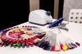 Russia, Tula, 07/11/2020. White Fraser and a palette of different varnishes for manicure and pedicure lie on the table