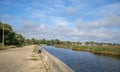 Russia, Tver region - 07 September 2020:landscape from the embankment of Lake Seliger. Man fishing with a fishing rod