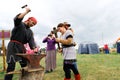 Russia, Tyumen, 15.06.2019. Blacksmith holds a master class on forging at the festival of different Nations. Hit the hammer on the