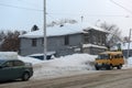 An old wooden house on the city street in winter Royalty Free Stock Photo