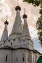 Russia, Uglich, July 2020. A dark thundercloud over the white three-domed Orthodox Church.