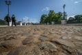 Russia, Uglich, people go over the bridge paved with cobblestones