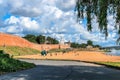 Russia, Veliky Novgorod, August 2021. Beach by the river and the walls of the city Kremlin.