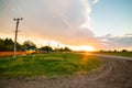 Russia village sunset spring bright sun road poles and wires