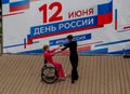 Russia, Vladivostok, 06/12/2018. Actor in wheelchair and usual actor perform the dance on stage. Annual celebration Russia Day on