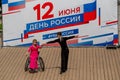 Russia, Vladivostok, 06/12/2018. Actor in wheelchair and usual actor perform the dance on stage. Annual celebration Russia Day on