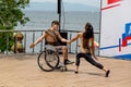 Russia, Vladivostok, 06/12/2018. Actor in wheelchair and usual actor perform the dance on stage. Annual celebration Russia Day on