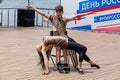 Russia, Vladivostok, 06/12/2018. Actor in wheelchair and usual actor perform the dance on stage. Annual celebration Russia Day on