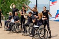 Russia, Vladivostok, 06/12/2018. Actors in wheelchairs and usual actors perform the dance on stage. Annual celebration Russia Day