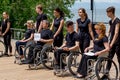 Russia, Vladivostok, 06/12/2018. Actors in wheelchairs and usual actors perform the dance on stage. Annual celebration Russia Day