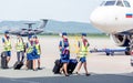 Russia, Vladivostok, 08/17/2020. Crew of airplane in official uniform and medical masks goes to board of plane. Crew of plane.