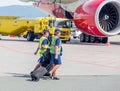 Russia, Vladivostok, 08/17/2020. Crew of airplane in official uniform of Rossiya Airlines goes to board of plane Boeing 777 of