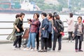 Russia, Vladivostok, 07/06/2019. Group of tourists from South Korea take photos on sights in city downtown. Tourism in Vladivostok