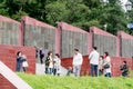 Russia, Vladivostok, 07/06/2019. Group of tourists from South Korea take photos on sights in city downtown. Tourism in Vladivostok