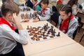 Russia, Vladivostok, 12/01/2018. Kids play chess during chess competition in chess club. Education, chess and mind games. Royalty Free Stock Photo