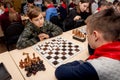 Russia, Vladivostok, 12/01/2018. Kids play chess during chess competition in chess club. Education, chess and mind games. Royalty Free Stock Photo