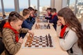 Russia, Vladivostok, 12/01/2018. Kids play chess during chess competition in chess club. Education, chess and mind games. Royalty Free Stock Photo