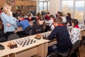 Russia, Vladivostok, 12/01/2018. Kids play chess during chess competition in chess club. Education, chess and mind games. Royalty Free Stock Photo