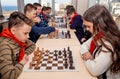 Russia, Vladivostok, 12/01/2018. Kids play chess during chess competition in chess club. Education, chess and mind games. Royalty Free Stock Photo