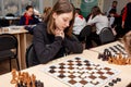 Russia, Vladivostok, 12/01/2018. Kids play chess during chess competition in chess club. Education, chess and mind games.