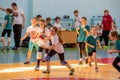 Kids play handball indoor. Sports and physical activity. Training and sports for children