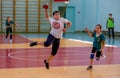 Kids play handball indoor. Sports and physical activity. Training and sports for children