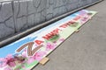 Russia, Vladivostok, May 16, 2022. Dirty banner with symbol Z on the ground. Styled inscription