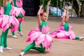 Russia, Vladivostok, 06/12/2018. Nice little girls in funny costumes of lotus flowers perform the dance on stage. Celebration of