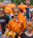 Participants of annual festive Tiger Day. Kids hold tiger drawing with the inscription `Take care of animals.`