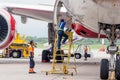 Passenger airplane Boeing 777-300 of Rossiya Airlines just landed. Engineers check aircraft systems.