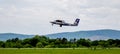 Passenger airplane De Havilland Canada DHC-6 of Aurora company takes off