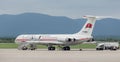 Passenger airplane IL-62M of Air Koryo North Korea on airfield in cloudy day. Aviation and transportation