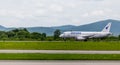 Passenger airplane Sukhoi Superjet 100 SSJ 100 of IrAero company on airfield