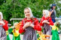 Russia, Vladivostok, 06/12/2018. Portrait of young adorable girl weared in traditional Russian Slavic clothes. Performance on