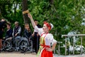 Russia, Vladivostok, 06/12/2018. Portrait of young adorable girl weared in traditional Russian Slavic clothes. Performance on