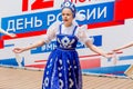 Russia, Vladivostok, 06/12/2018. Portrait of young adorable girl weared in traditional Russian Slavic clothes. Performance on