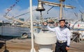 Russia, Vladivostok, 07/28/2018. Portrait of young sailor in official marine uniform on the deck of the sailboat. Concept of