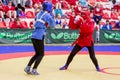 Russia, Vladivostok, 06/30/2018. Women self-defence show. Fighters in protective helmets box against each other. Wrestling,
