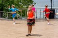 Russia, Vladivostok, 06/12/2018. Young adorable girl in colourful clothes perform song on stage. Celebration of annual Russia Day