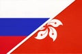 Russia vs Hong Kong national flag from textile. Relationship and partnership between two countries Royalty Free Stock Photo