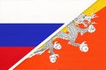 Russia vs Kingdom of Bhutan national flag from textile. Relationship and partnership between two countries Royalty Free Stock Photo
