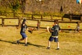 Russia. Vyborg. 08.21.2020. Children fight with wooden swords at a knight`s festival Royalty Free Stock Photo