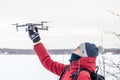 Russia Vyborg. 02.02.2021 A young man launches a quadcopter in winter