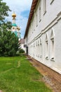 Russia, Yaroslavl, July 2020. Facade of a residential building in an Orthodox monastery and a dome of a church. Royalty Free Stock Photo