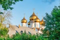 Russia, Yaroslavl, July 2020. The gilded domes of an Orthodox cathedral in the golden rays of the setting sun.